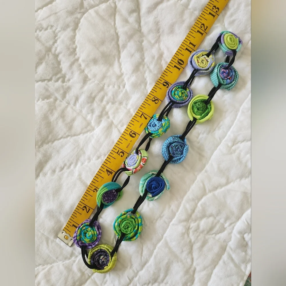 Multi colored coiled fabric necklace